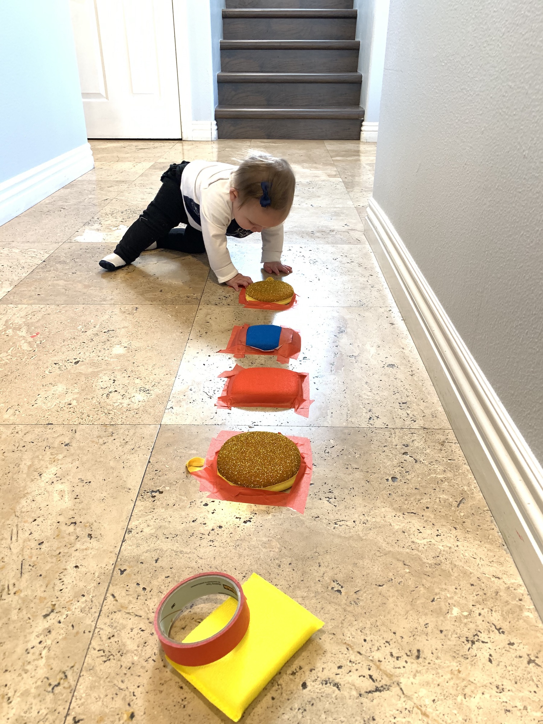 Sponges on ground in row baby crawling