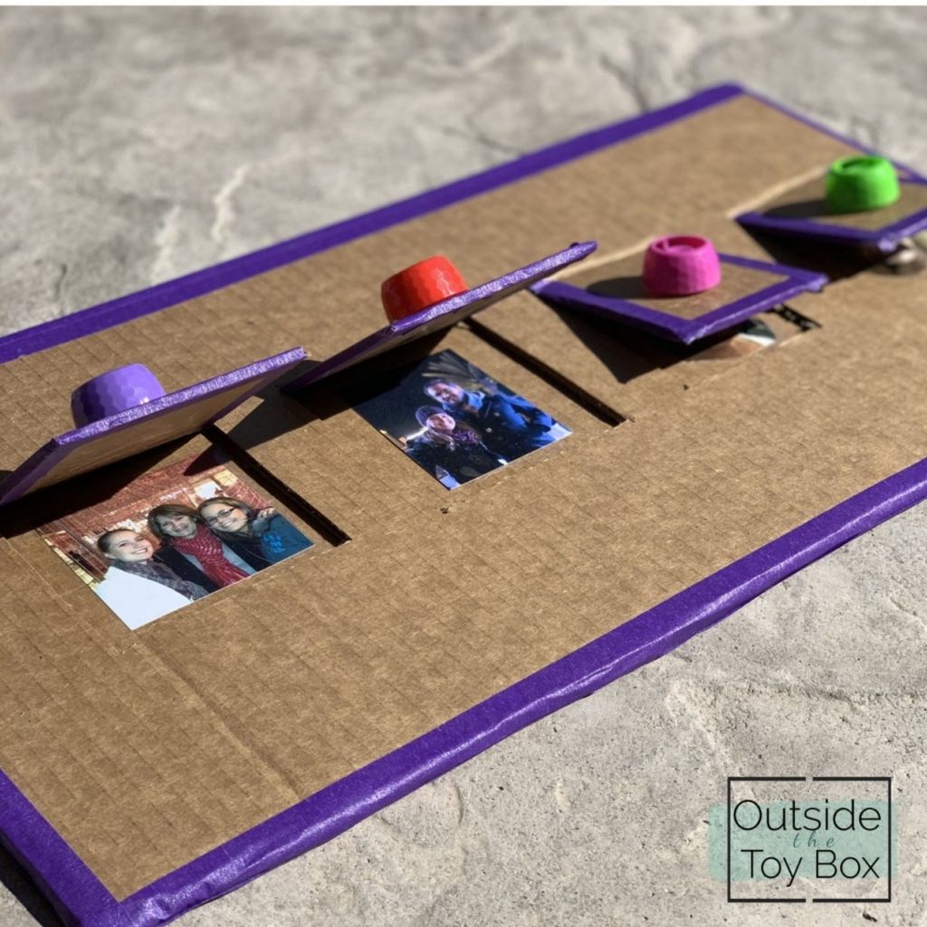 Carboard with flaps cut out and pictures under