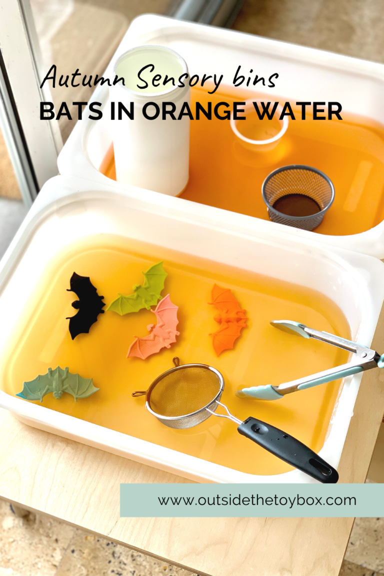 Two bins of orange water with bats containers and scoops