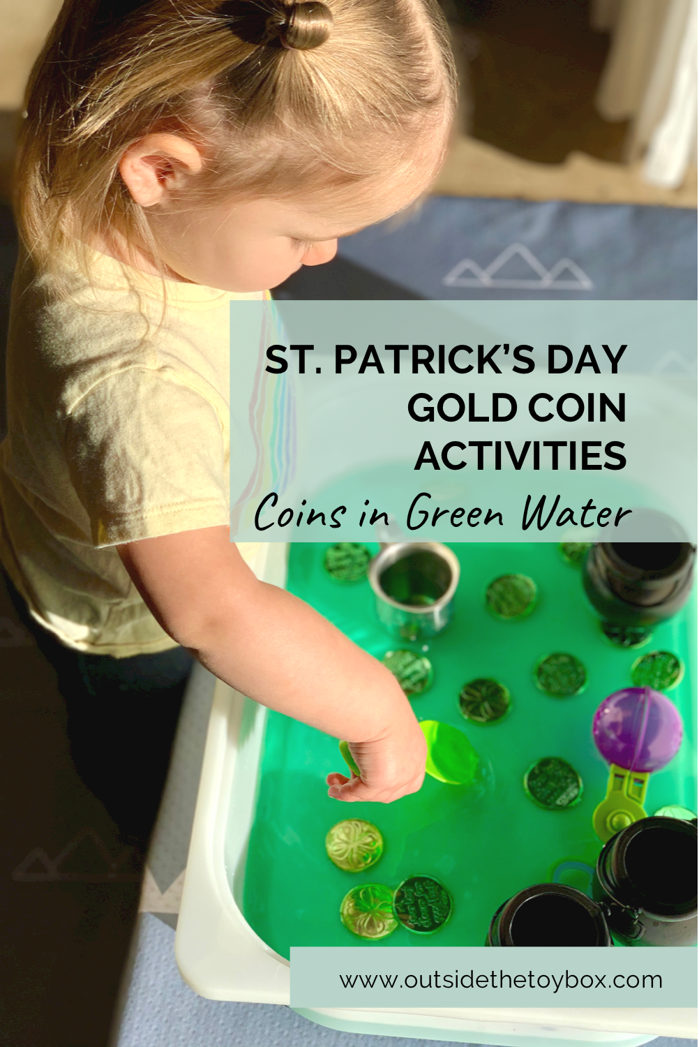 Toddler playing with gold coins in green water