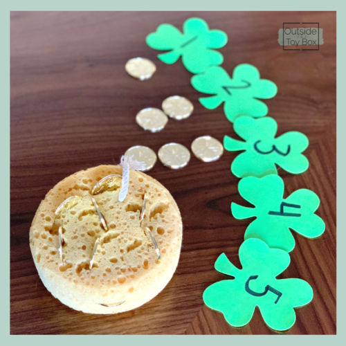 gold coins next to shamrocks with numbers
