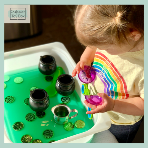 toddler opening fine motor tool above green water sensory bin