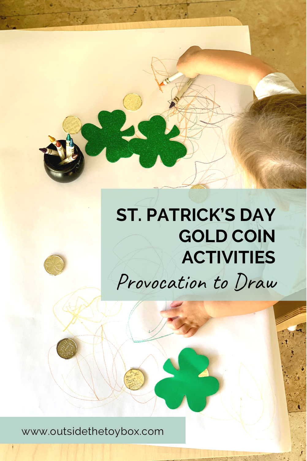 Toddler drawing with crayons with Shamrocks and gold coins on paper