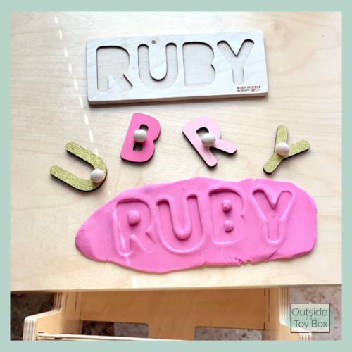 Name puzzle with letters imprinted in play dough