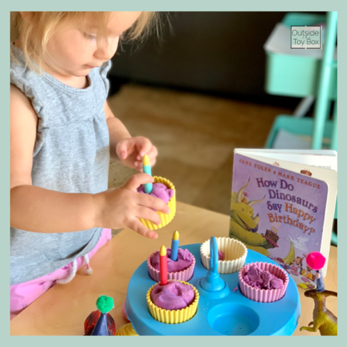 toddler playing with play dough cupcakes
